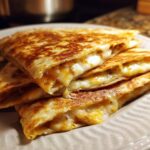 Stack of golden-brown 3-Ingredient BBQ Chicken Quesadillas with melted cheese and filling.