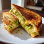 Close-up of a 5-Ingredient Avocado Toast Omelette cut in half, showcasing the ingredients.