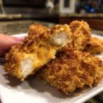 Close-up of Oven-Baked Cheddar Jalapeño Chicken Tenders showing melted cheddar cheese.