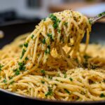 Close-up of 5-Minute Lazy Girl Pasta with Garlic Parmesan, garnished with parsley and cheese.