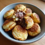 Close-up of a Nutella-Stuffed Pancake Cereal Bowl, showing the melted Nutella filling.