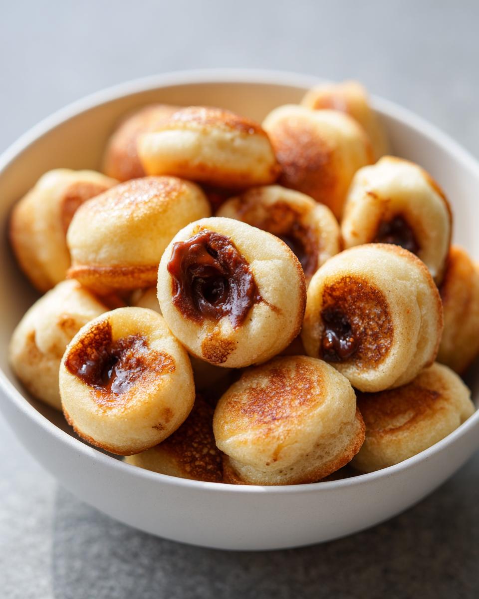 Close-up of a bowl filled with Nutella-Stuffed Pancake Cereal.