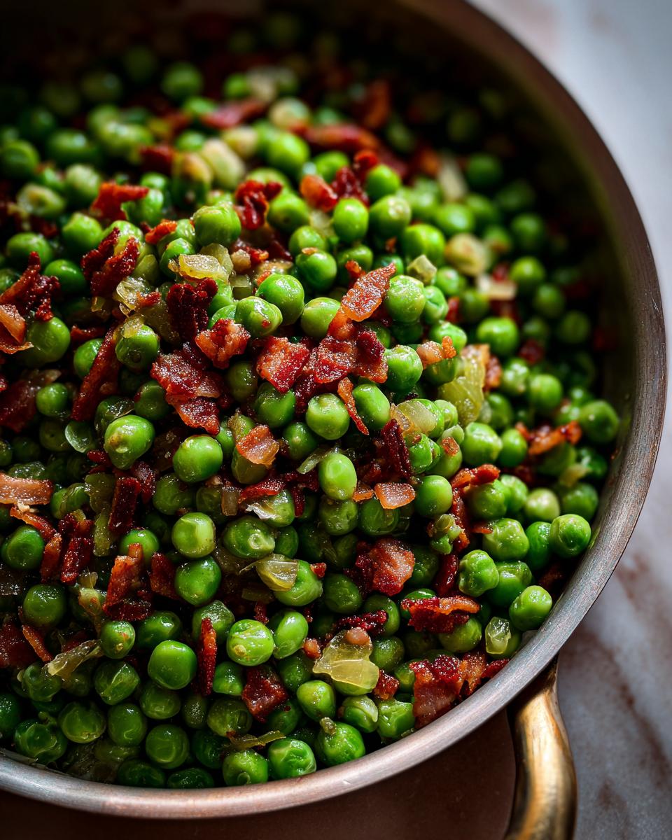 Close-up of vibrant green Peas with Pancetta in a pan, cooked and ready to serve.