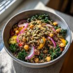 Close-up of a Quinoa Kale Power Bowl with kale, quinoa, chickpeas, and vegetables.