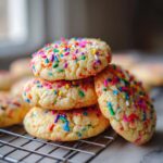 A stack of delicious Sprinkle Sugar Cookies, showcasing their colorful candy sprinkles and soft texture.
