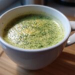 Close-up of a mug filled with Keto Broccoli Cheese Soup, a low-carb and keto-friendly recipe.
