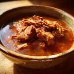 Close-up of a bowl of delicious Oxtail Soup, a comforting and flavorful dish.