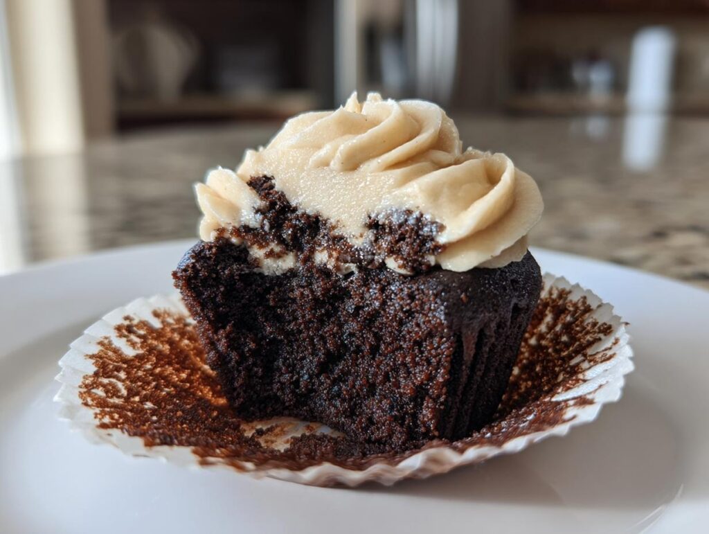 Close-up of a Chocolate Guinness Cupcake with frosting, showing the moist cake texture.