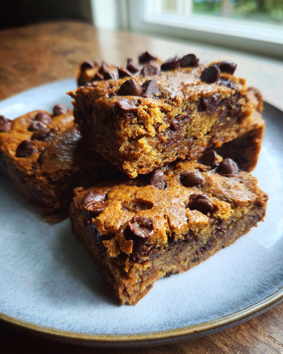 Close-up of several bars better than brownies with chocolate chips on a plate.