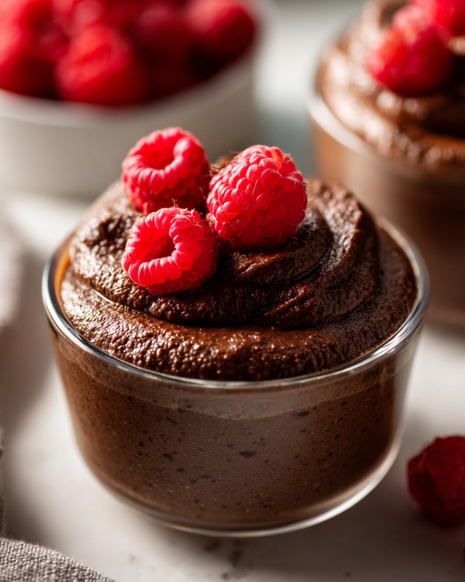 Close-up of a chocolate dessert with raspberries, perfect for the Simplest Dessert with the Biggest Flavor.