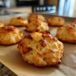 Close-up of freshly baked 3-Ingredient Tuna Cat Treats on parchment paper, ready to be enjoyed.