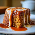 Close-up of a Biscoff Sticky Toffee Pudding, drizzled with caramel sauce, a dessert.