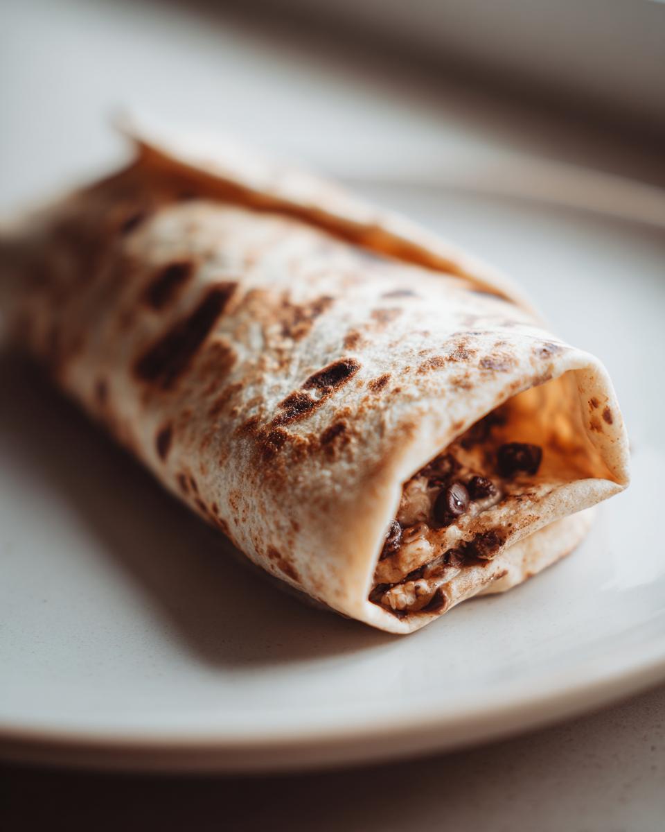 Close-up of a Chocolate Crunchy Wrap on a plate, showing the filling.