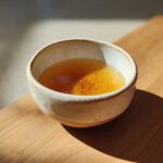 A bowl of delicious fish broth for cats, ready to serve. This fish broth cat recipe is quick and easy!