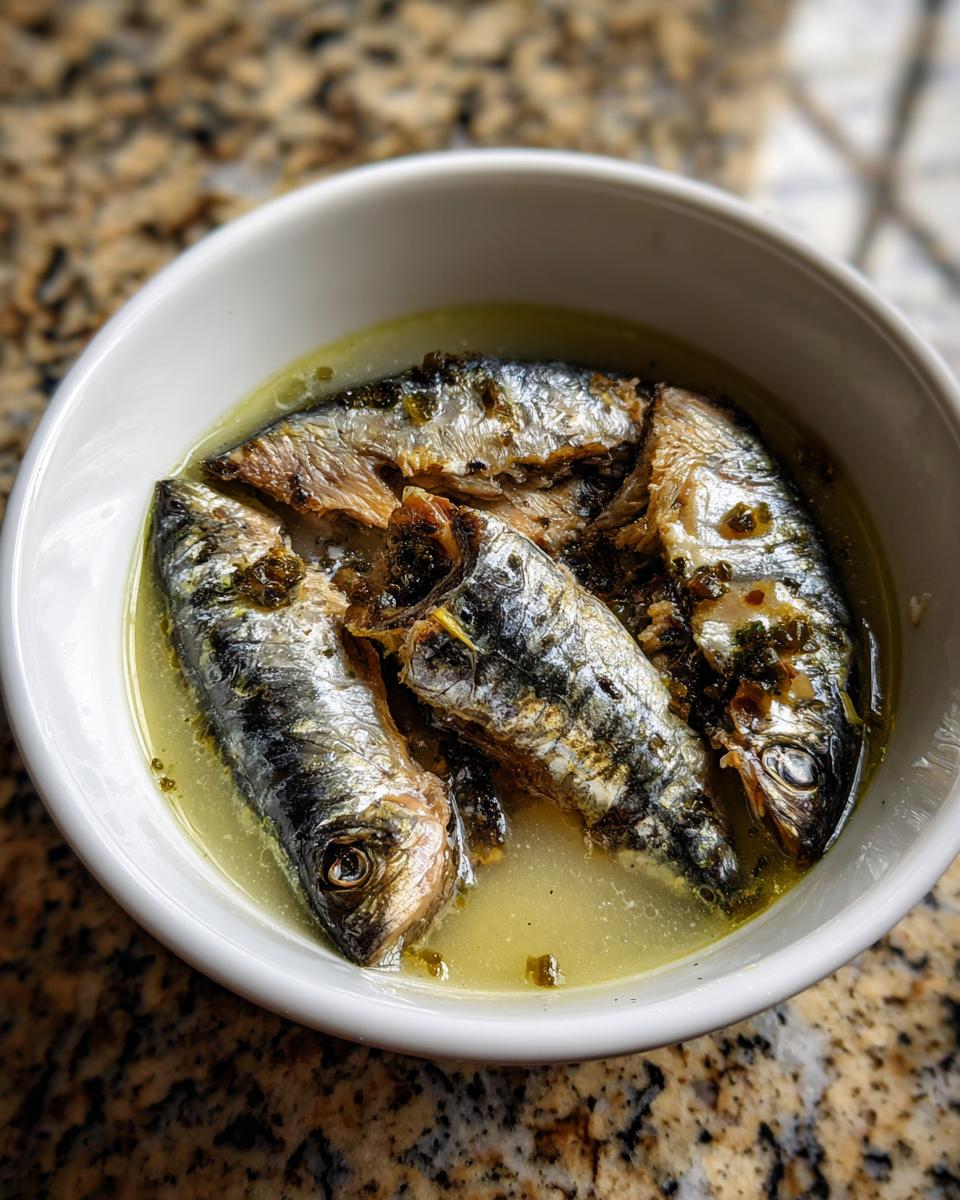 Close-up of fresh sardines in a bowl, ready for a Fresh Sardine Cat Dinner.