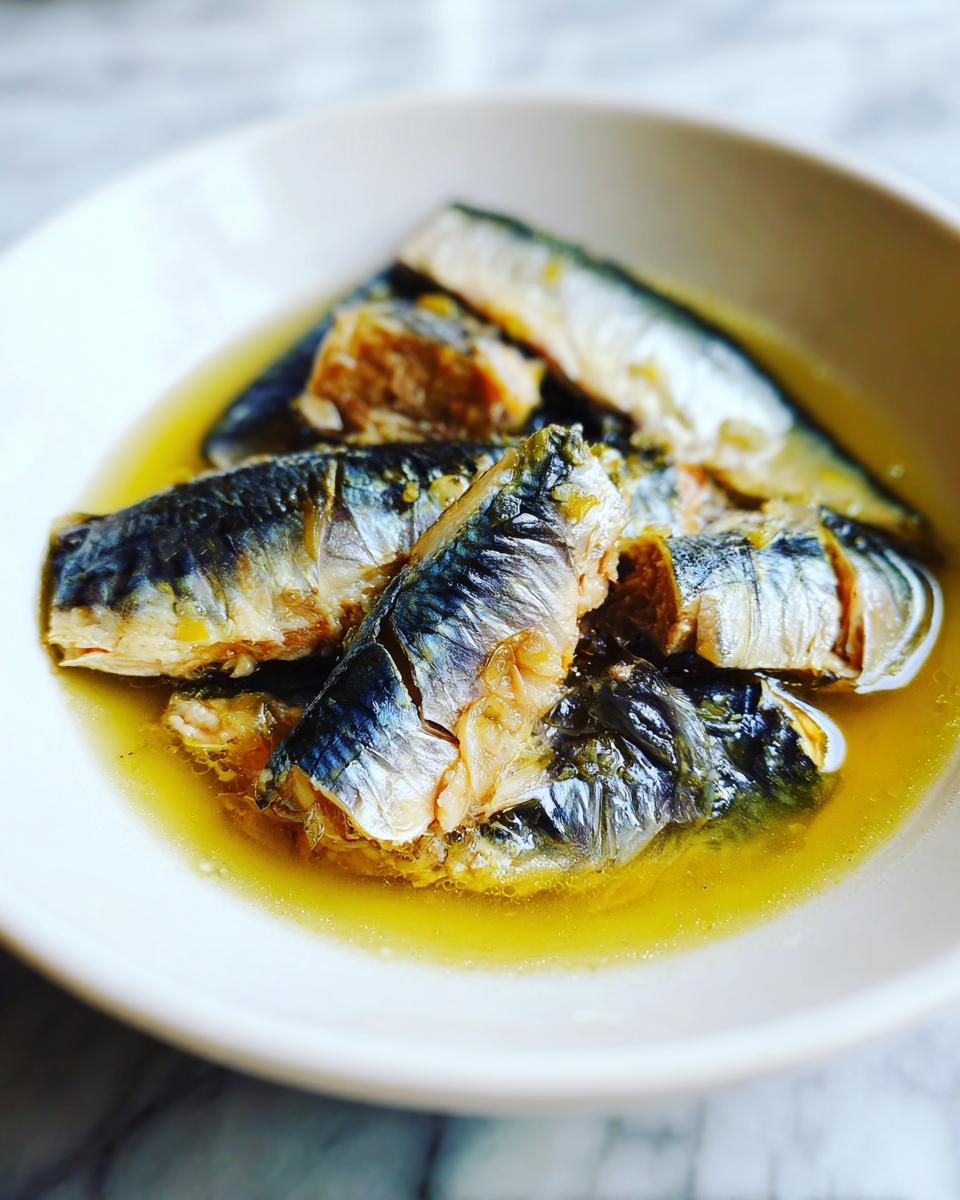 Close-up of fresh sardines in a bowl, ready for a Fresh Sardine Cat Dinner.