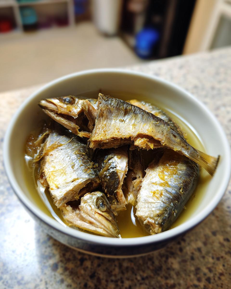 Close-up of fresh sardines in a bowl, ready for a Fresh Sardine Cat Dinner.