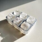 Close-up of frozen tuna cat treat cubes in a tray, ready to serve. The image shows the frozen tuna cat treat cubes.