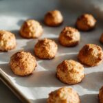 Close-up of freshly baked Hairball Support Cat Treats on parchment paper, ready to be enjoyed.
