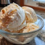 Close-up of scoops of Honey Lavender Ice Cream in a glass bowl, creamy and delicious.